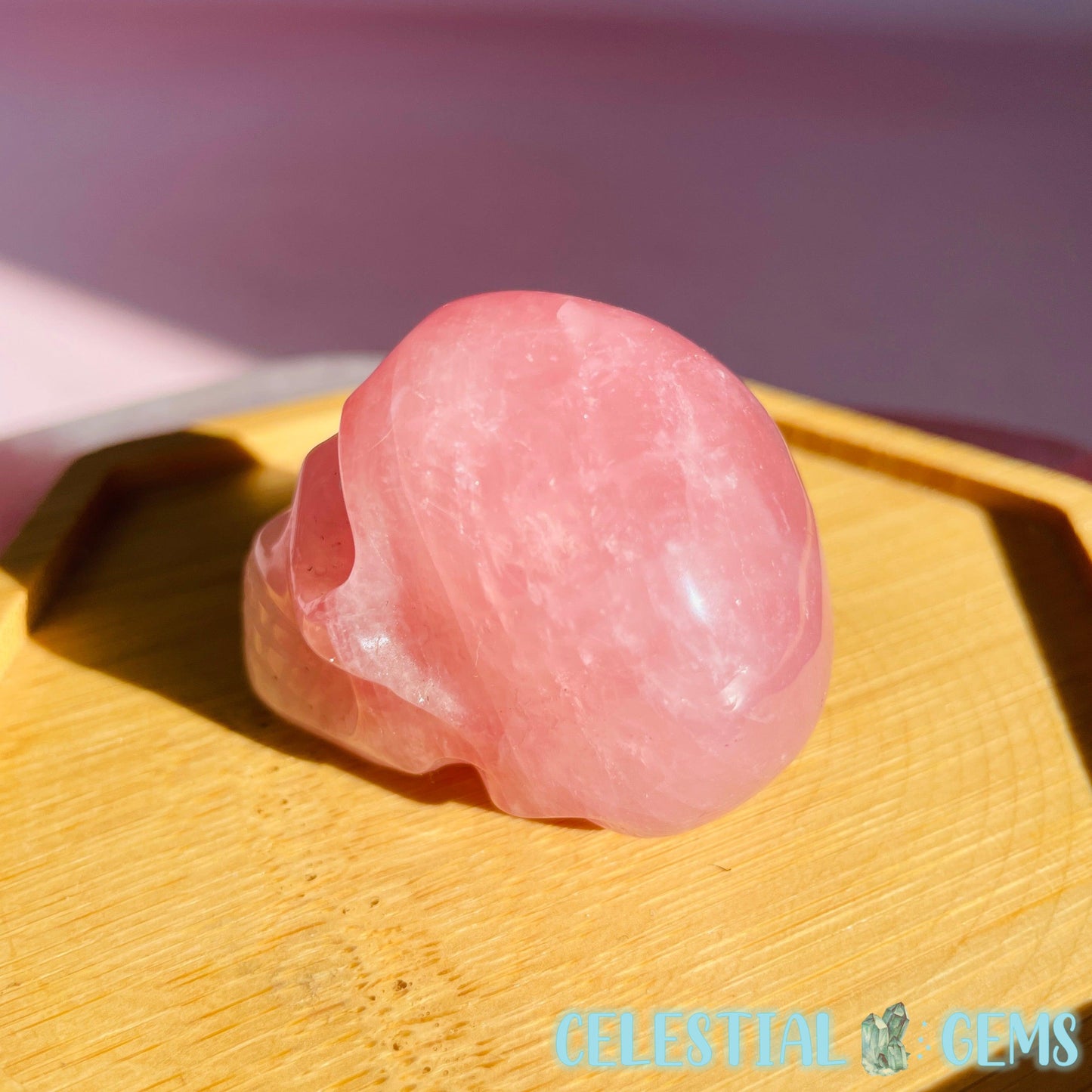 Rose Quartz Skull Small Carving With Star Flash