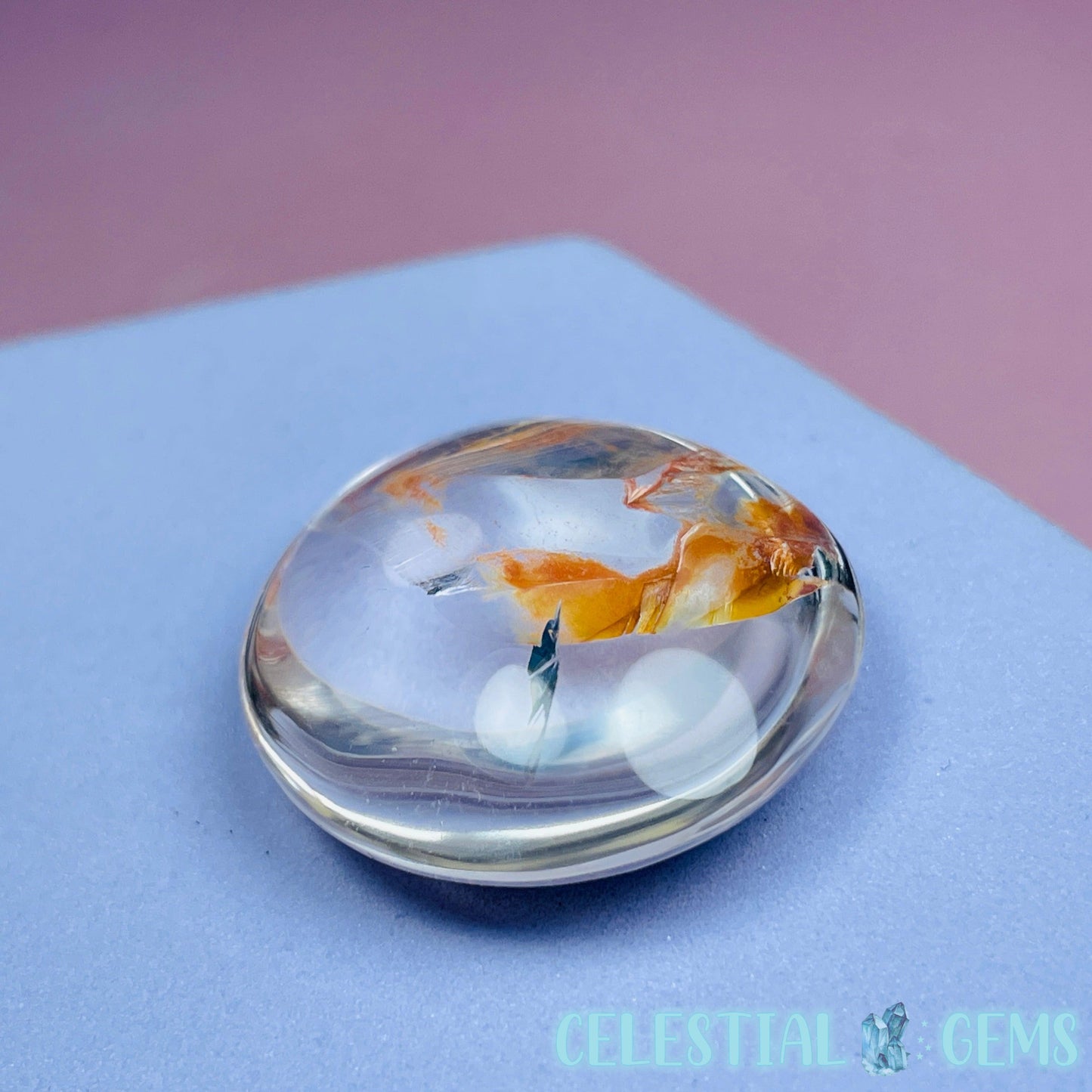 Iron 'Koi Fish' Clear Quartz Round Stone